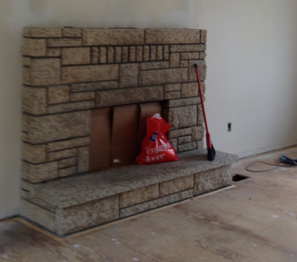 painting concrete fireplace - before