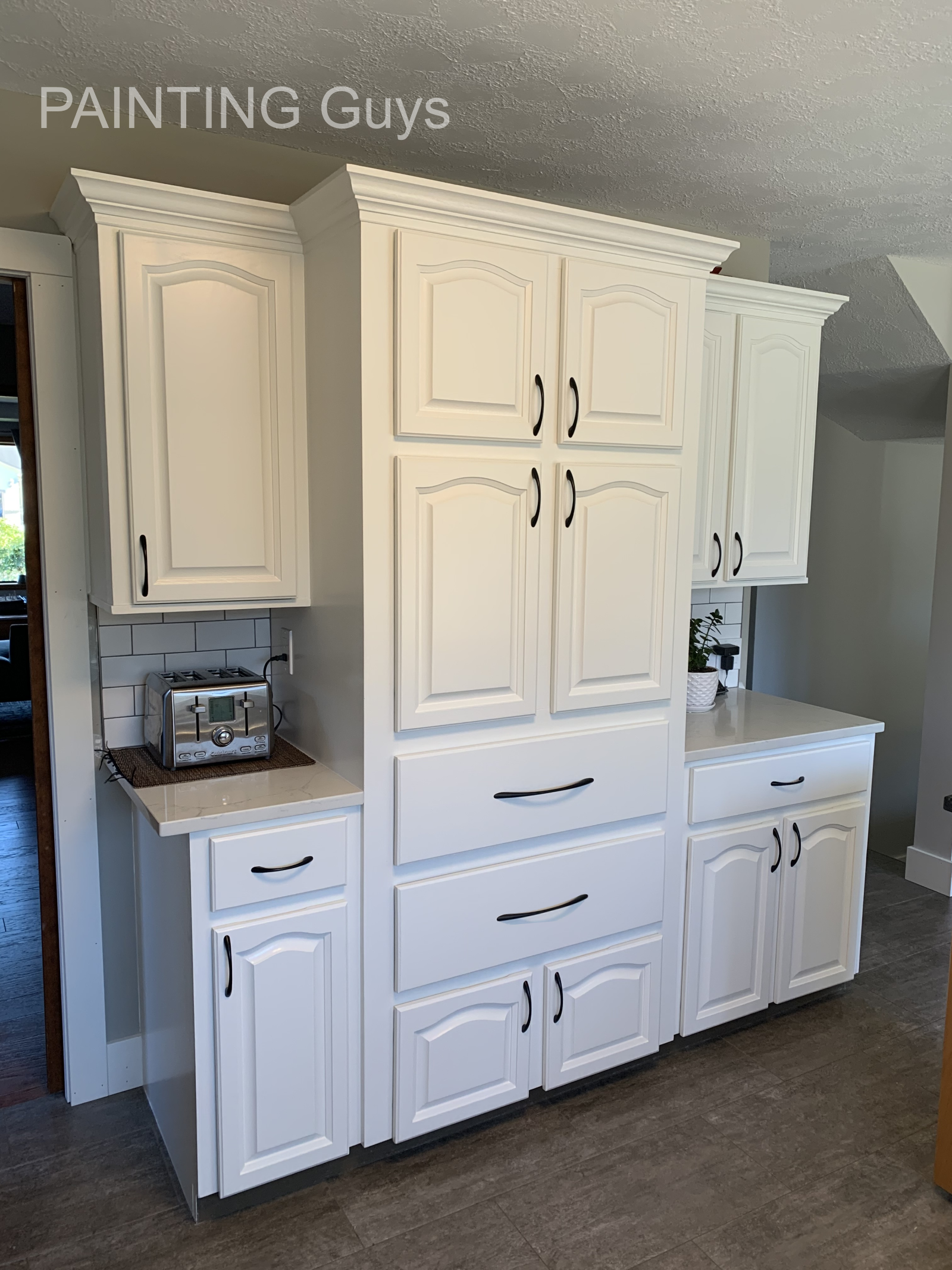 oak kitchen cabinet refinished in Cloud White