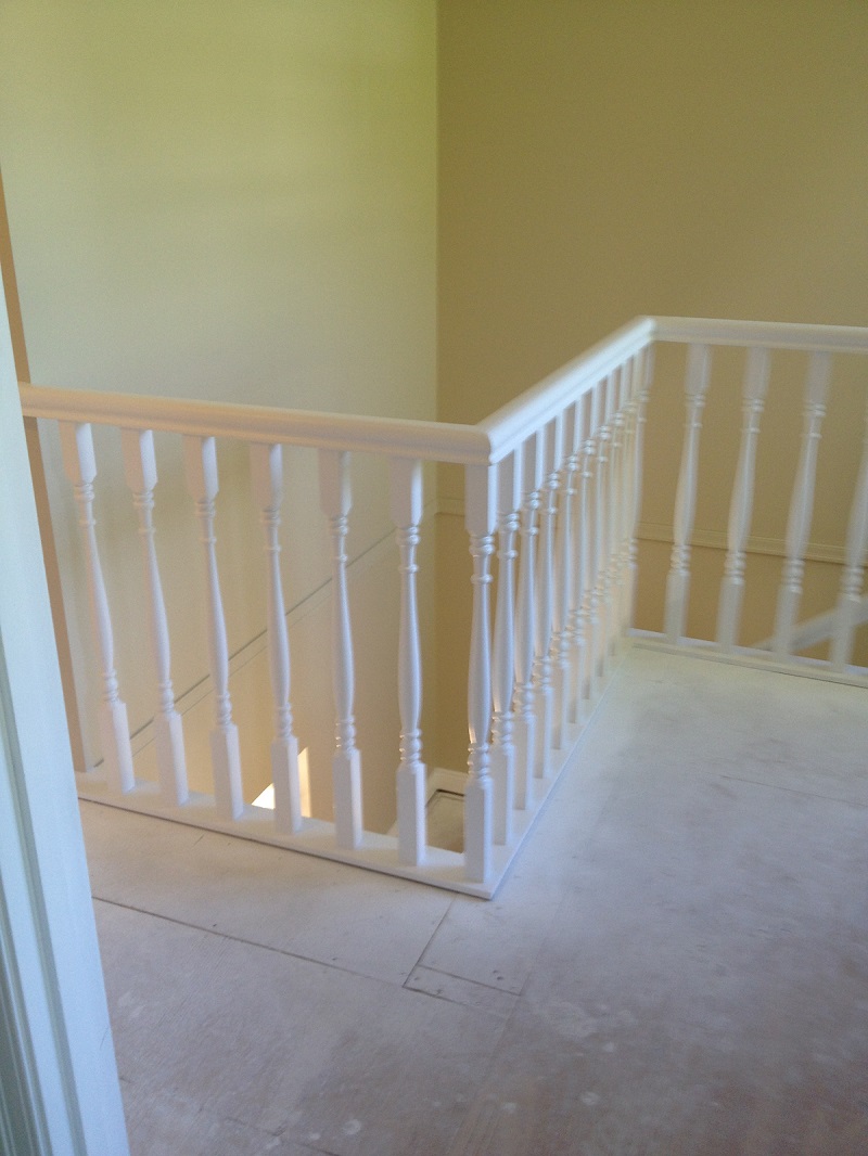 Wood railings painted white after