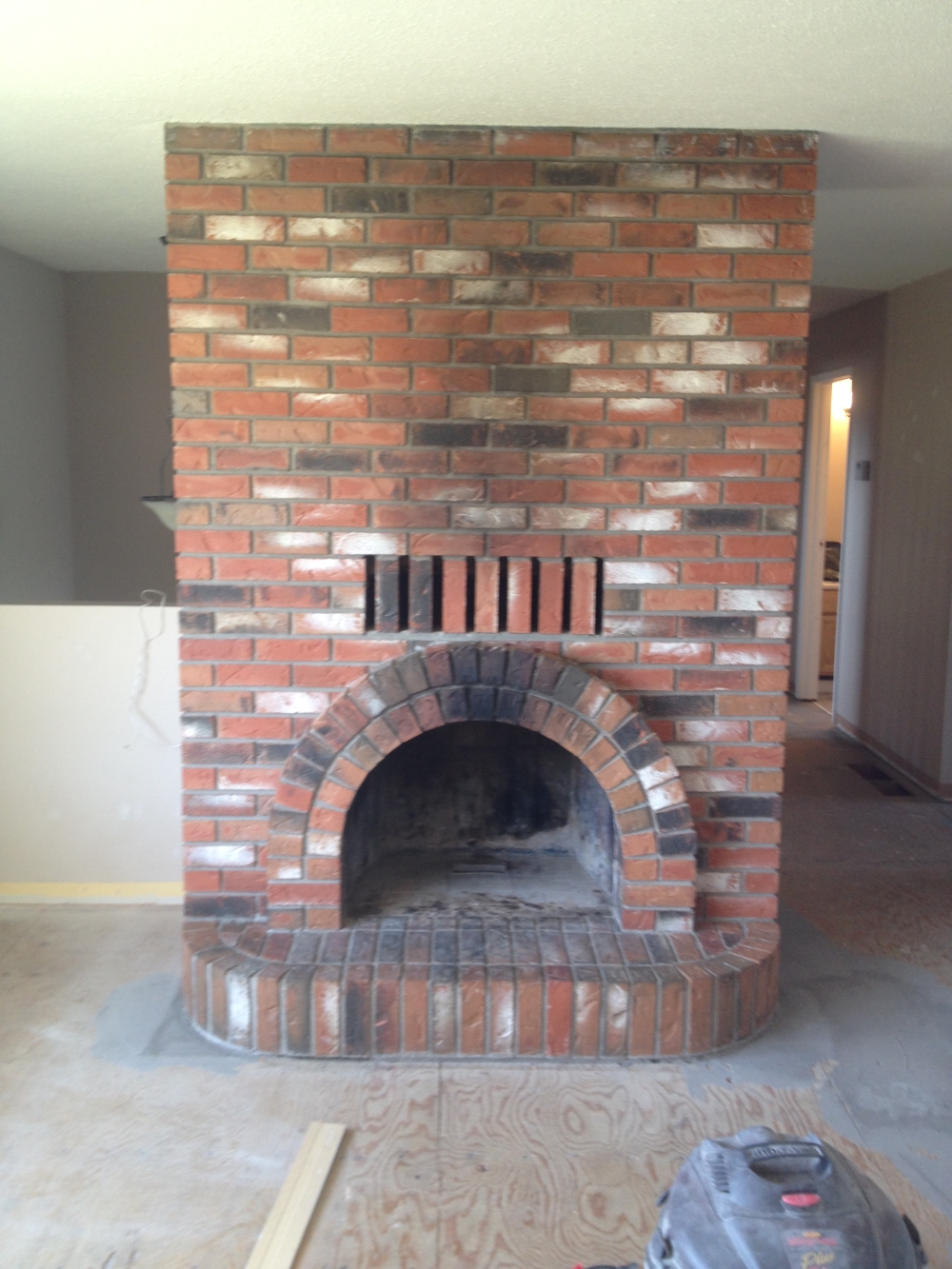 painting a brick fireplace before