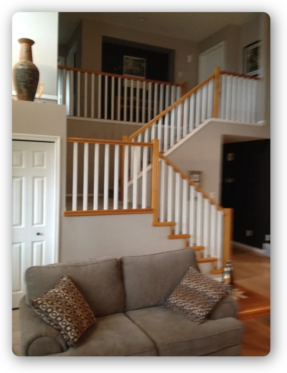 Natural wood railings with painted white spindles