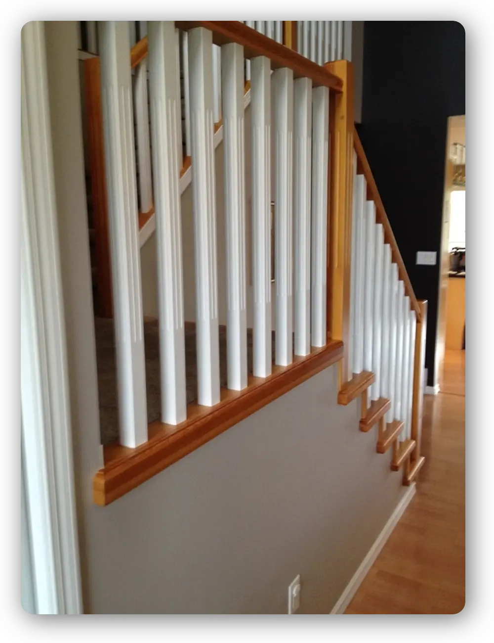 Natural wood railings with white spindles